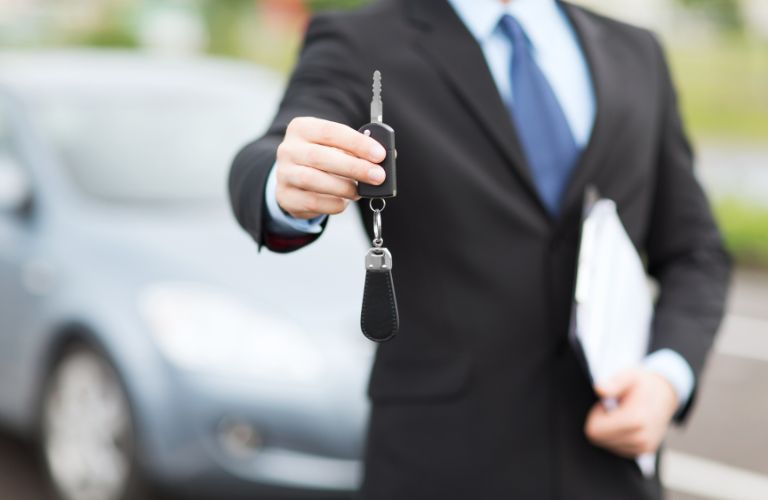 Hand of a man holding a key